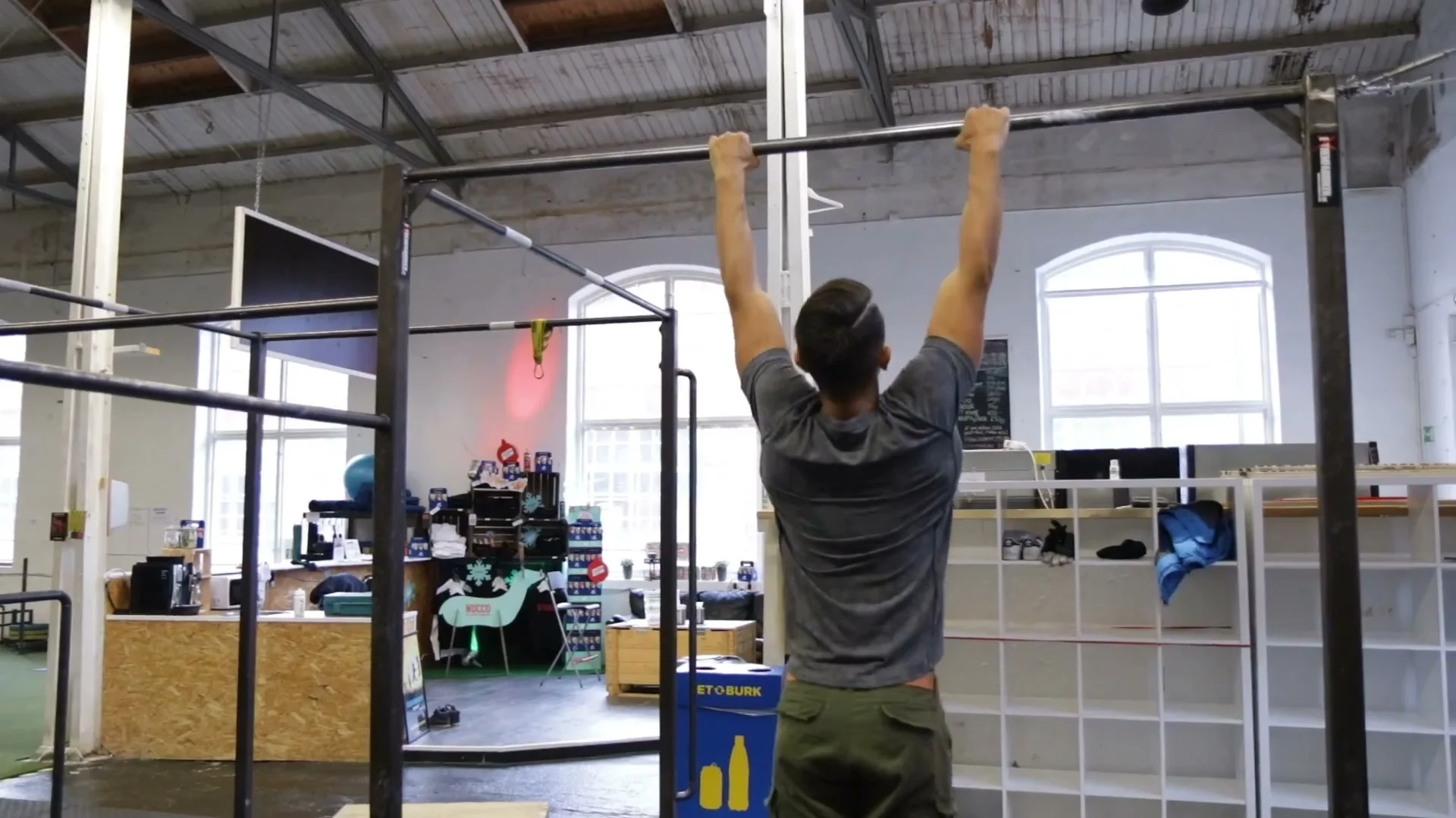 Pull-ups on a bar demonstrating proper form for the first calisthenics freestyle requirement