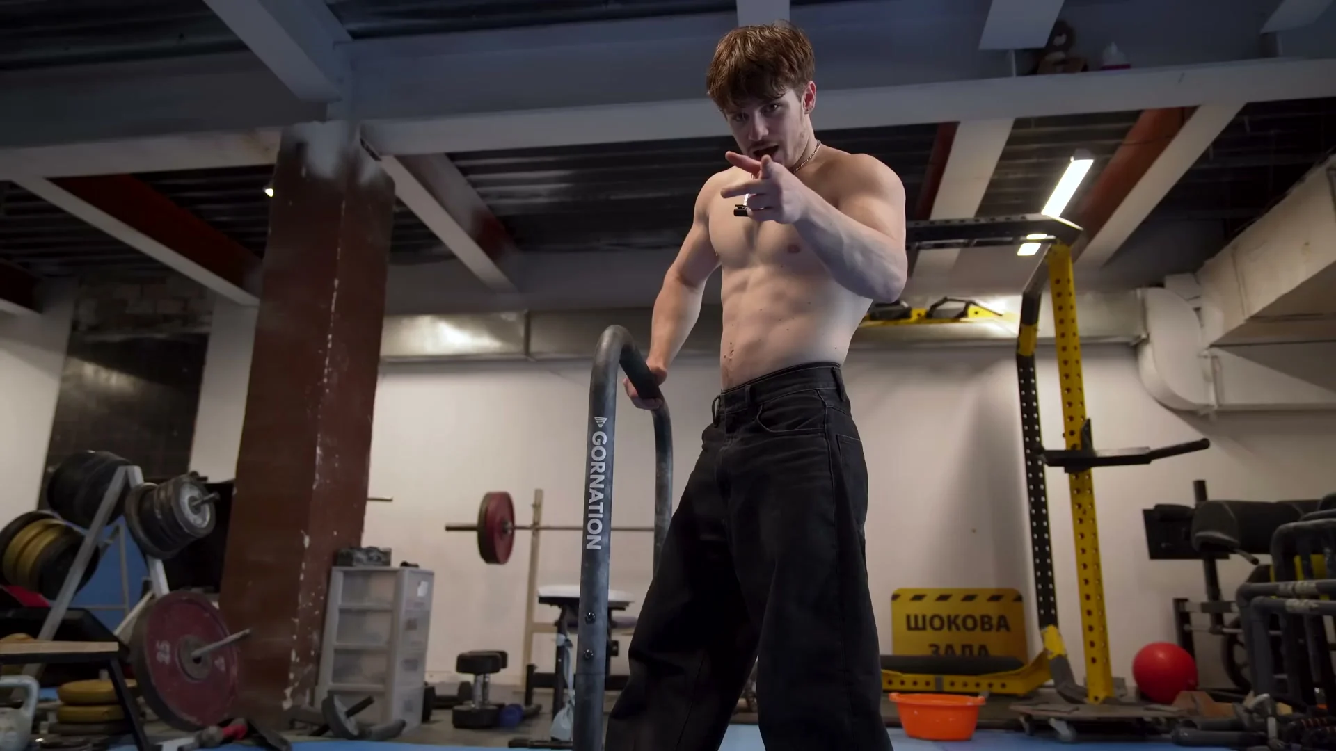 Nathan Bosech demonstrating the front lever raise with trap retraction finish at the top of the movement