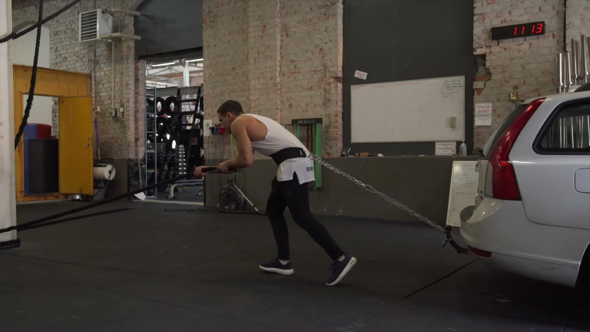 Daniel Flefil pulling a car using the Gornation Dip Belt around his waist