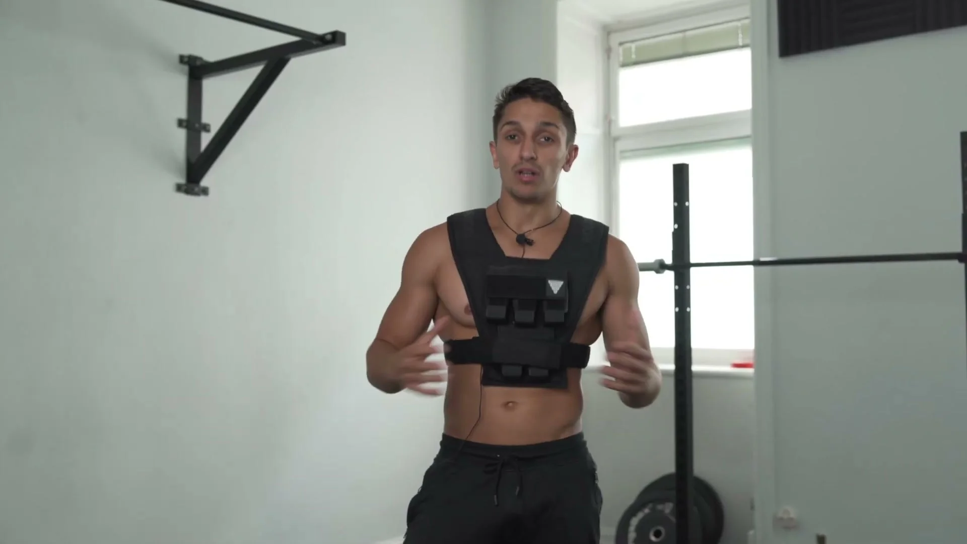 Daniel Flefil landing a box jump with the GORNATION weight vest showing minimal movement of the vest