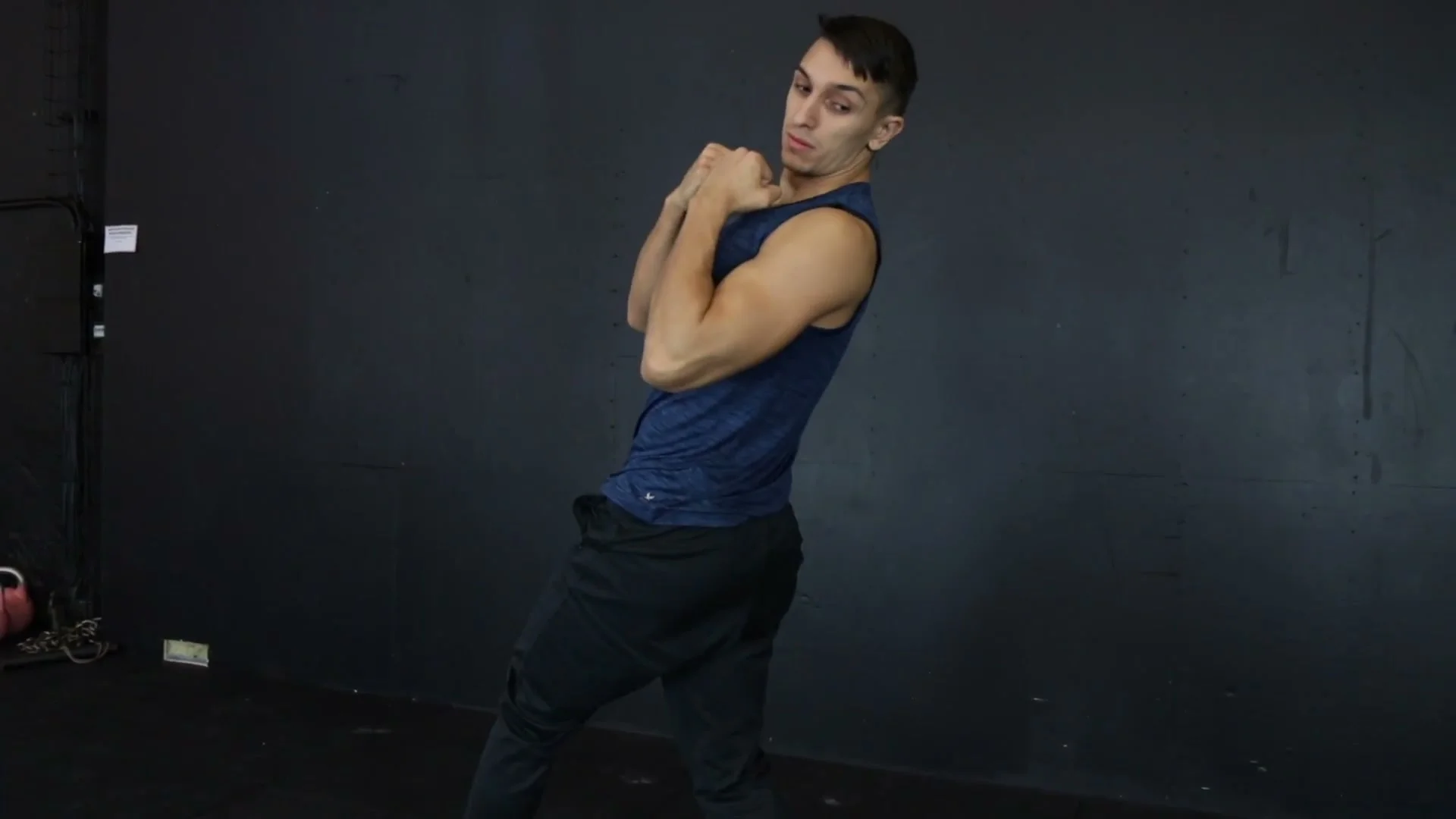 Arm spin motion for the push-up 360 demonstrated standing: arms crossing in front of the chest to drive the 360 rotation