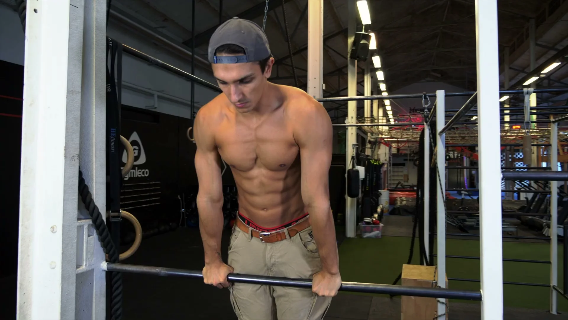 Deep straight bar dips for slow muscle up: body lowered to the point where elbows are parallel with the bar, building strength for the hardest transition point