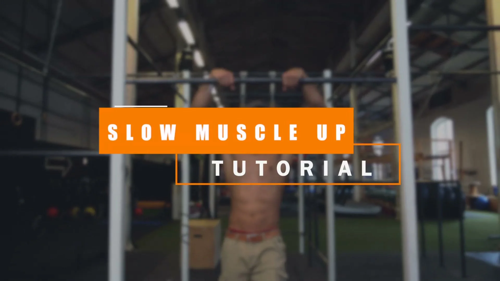 Daniel Flefil performing the slow muscle up on the bar: pulling through the transition point with false grip, chest past the bar