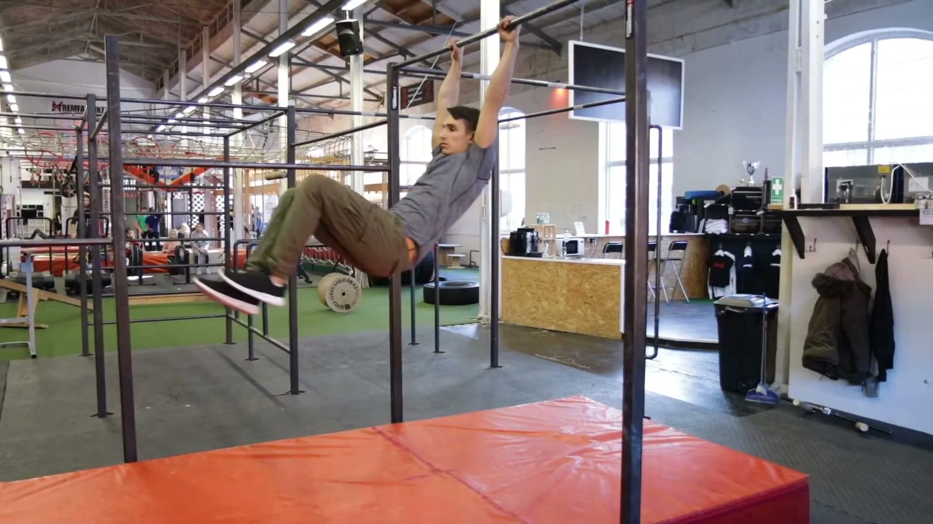 Swing gainer step 4 on a higher bar, jumping to the bar and performing the release with mat on the floor for safety