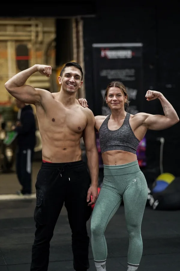 Daniel Flefil and Malin Malle Jansson flexing together at a calisthenics competition